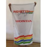 A PADGETT'S HONDA motorcycles banner, with various team signatures including John McGuinness and Ian