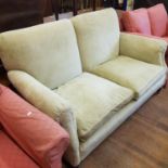 An early 20th century cream two seater settee, on turned legs, 163 cm wide, and an armchair (2)