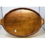 A walnut and brass bound oval tray, 60 cm wide