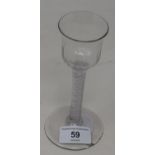 An 18th century wine glass with opaque air twist stem, 15 cm high