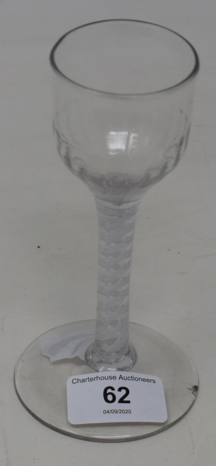 An 18th century wine glass with opaque air twist stem, 15 cm high