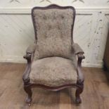 A Victorian walnut armchair, on cabriole front legs