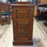 An early 20th century walnut pot cupboard, 84 cm high