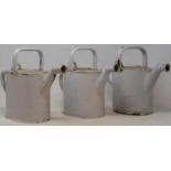 Three white enamel watering cans, a leather jewellery box, and a metal box (5)