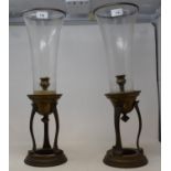 A pair of brass and glass storm lanterns, 55 cm high