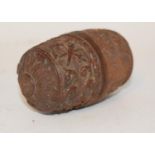 A late 18th/early 19th century nut, in two parts with a screw section, initialled, carved figures