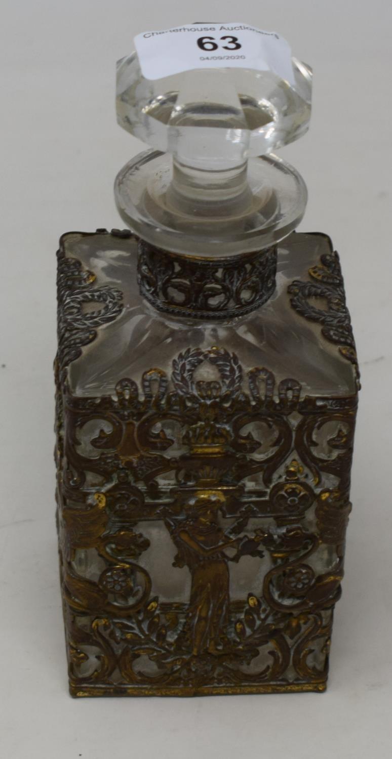 A 19th century Continental decanter, with gilt metal mounts decorated with mythical beasts and