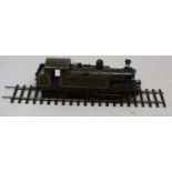 An 0 gauge 0-4-4 electric locomotive, in green, No 770 We have not had this loco running , appears