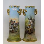 A pair of early 20th century Continental porcelain vases, decorated with landscapes and figures,