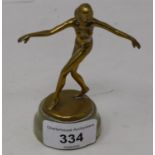 An Art Deco brass figure of a lady, on oynx base, 10 cm high