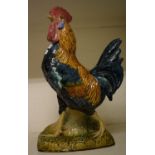 A French stoneware cockerel, 62 cm high Does not sit level, various chips to edges most notable on