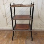 An ebonised three tier etagere, inlaid with amboyna and crossbanded, 45 cm wide Report by RB One