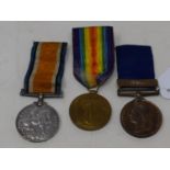 A Metropolitan Police 1887 Jubilee medal, awarded to PC J P Atcliffe X Div, and World War I pair