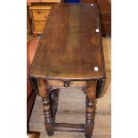 An 18th century style oak drop leaf table, 96 cm wide