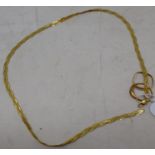 A 9ct gold necklace, 4.0 g, a 22ct gold wedding band, cut, 0.9 g, and a 9ct gold dress ring, lacks