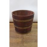 A mahogany and brass bound bucket, 36 cm diameter