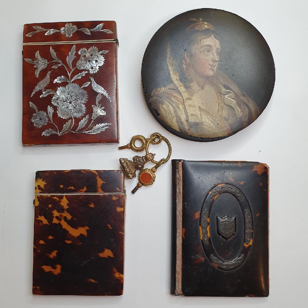 A 19th century paper mache box, painted a lady, 10 cm diameter, two 19th century tortoise cardcases,