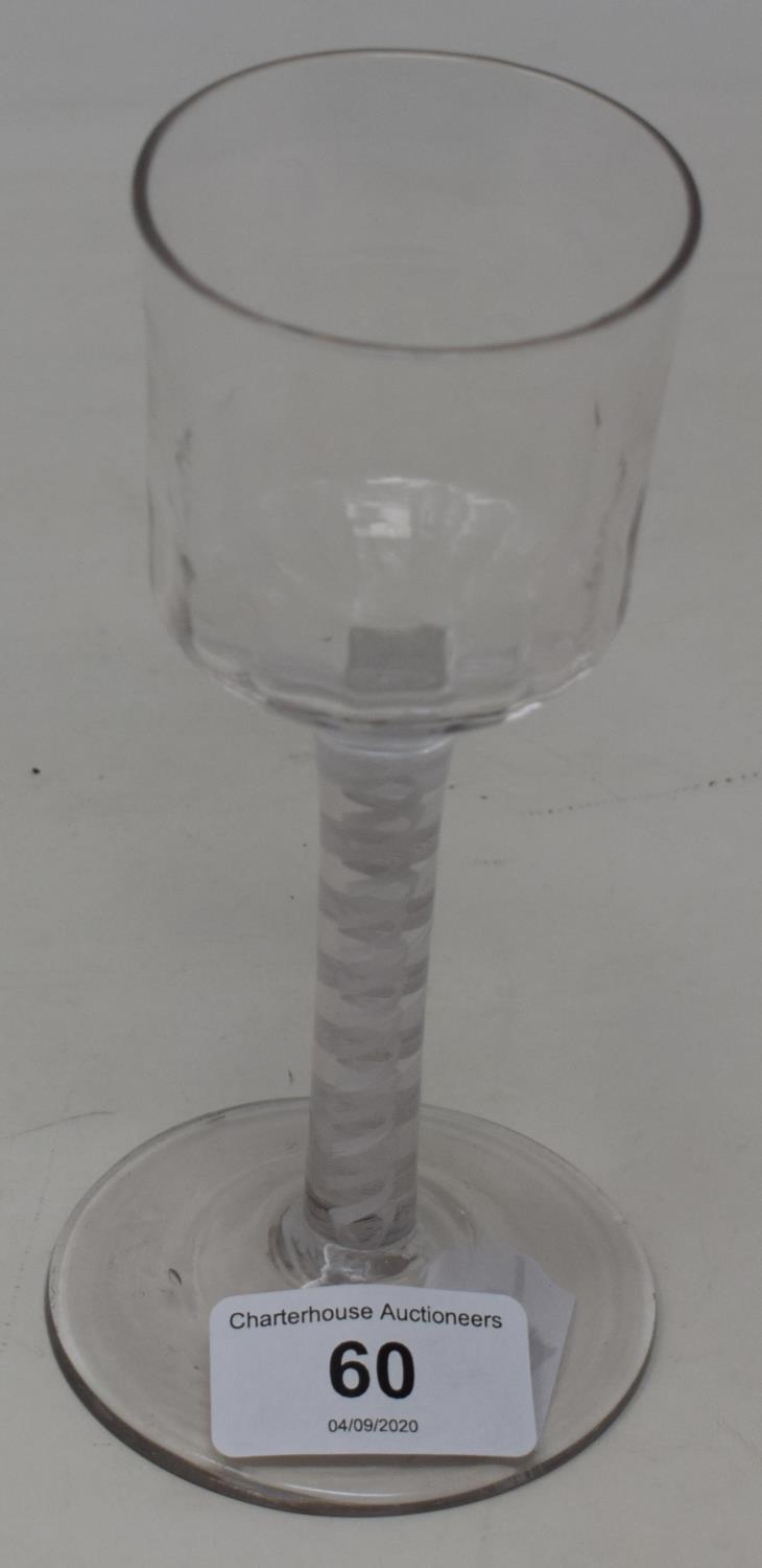 An 18th century wine glass with opaque air twist stem, 15 cm high