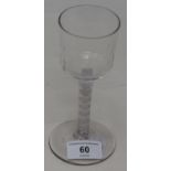 An 18th century wine glass with opaque air twist stem, 15 cm high