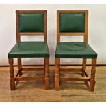 A Derek Lizardman Slater set of eight oak and green leather upholstered dining chairs (8) Light ware