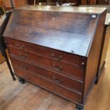 A 19th century oak bureau, 108 cm wide, and and a pair of oak cupboards (3)