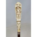 A 19th century fruit wood walking stick, with carved ivory handle in the form of a lion emerging