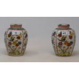 A pair of Chinese vases and covers, decorated with flowers, 17 cm high