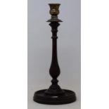 A 19th century mahogany and silver plated candlestick, on a circular foot, 34 cm