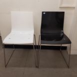 A set of eight modern plastic and chrome dining chairs, three black, three white and two orange (8)