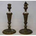 A pair of 19th century brass candlesticks, 34 cm high