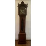 A longcase clock, the 29.5 cm arch square dial with a silvered chapter ring having Roman numerals,