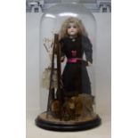 A 19th century bisque head doll, modeled as an artist, in glass dome (cracked), 58 cm high