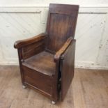 An unusual 19th century country made armchair, incorporating a drop leaf table section