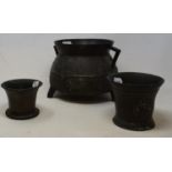 A bronze mortar, 8 cm high, another 12 cm high, and cast bronze cauldron (3)