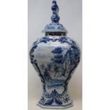 A 19th century delft blue and white vase and cover, 44 cm high