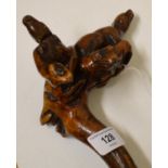 A 19th century carved folk art walking cane, the root handle depicting a man's head, dog, snake