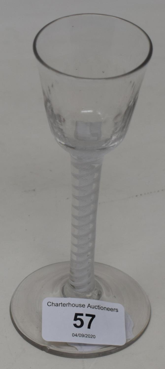 An 18th century wine glass with opaque air twist stem, 14 cm high