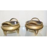 **This lot has been withdrawn** A pair of Chinese brass censors, with loop handles and seal type ma