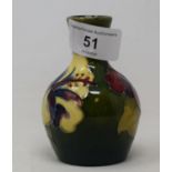 A Moorcroft vase decorated with flowers, 9 cm high