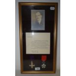 A pair of medals, awarded to H B Jacks, comprising an OBE and a Legion of honour, framed with a