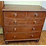 A 19th century mahogany chest, having two short and three long drawers, on bun feet, 108 cm wide