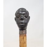 A 19th Century Malacca shafted walking stick, with carved ebony handle in the form of an African