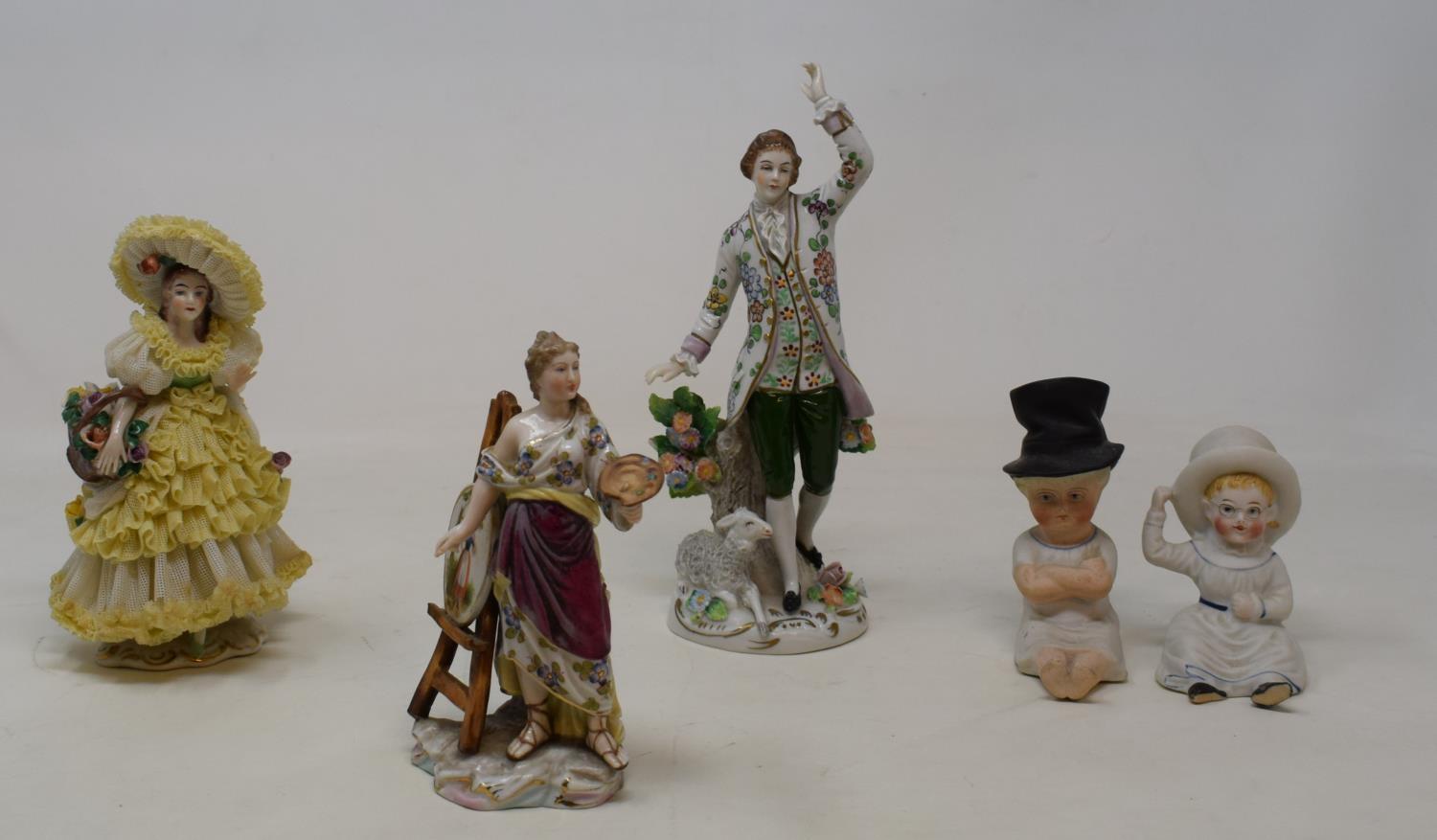 An 19th century Dresden figure of an artist, 12 cm high, and other 19th century and later figures (