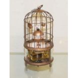 A clock, in the form of a birdcage, 18 cm high Report by RB Modern