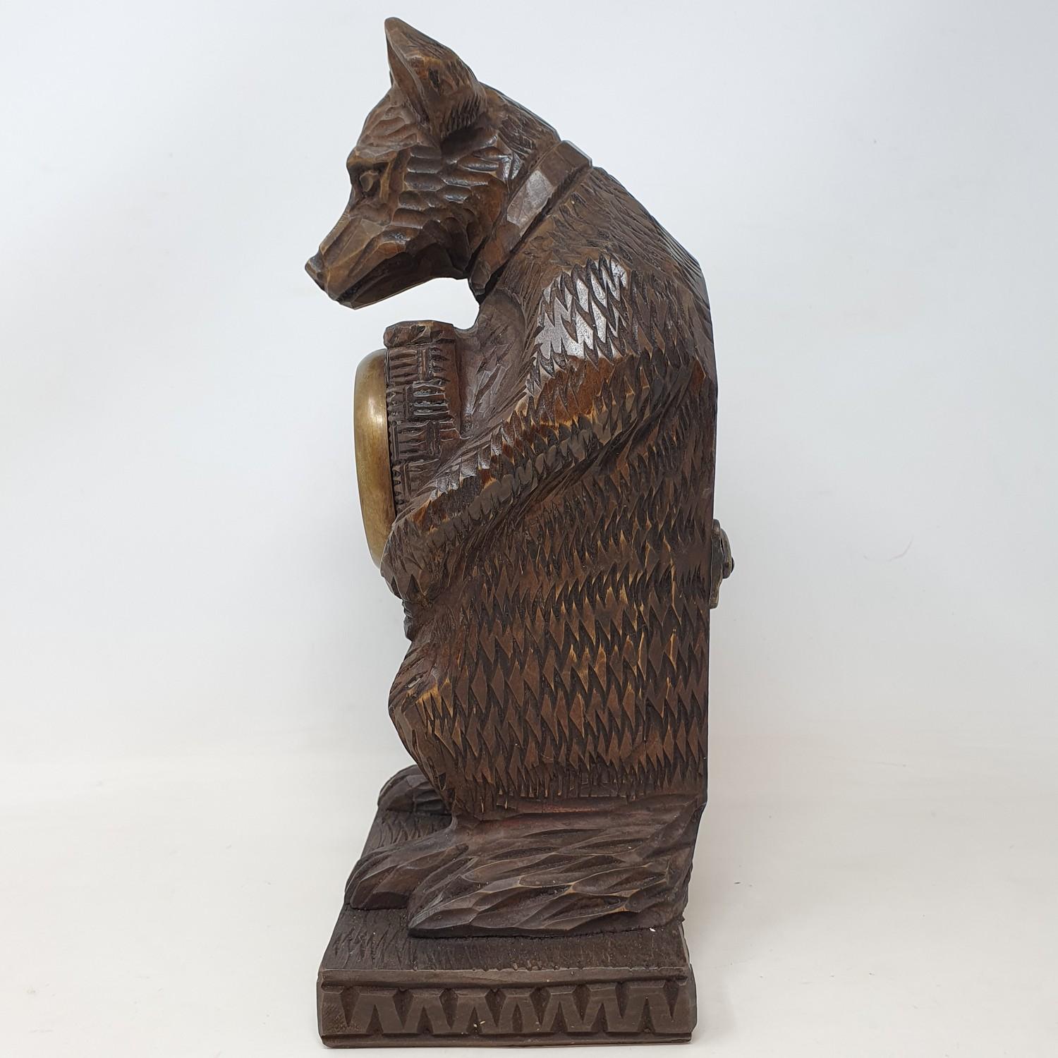 A timepiece, with Arabic numerals, in a Black Forest style carved wood bear case, 30 cm high - Image 3 of 5