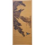 A Japanese painted hanging scroll, decorated with an eagle in a pine tree, signed, the image 93 cm x