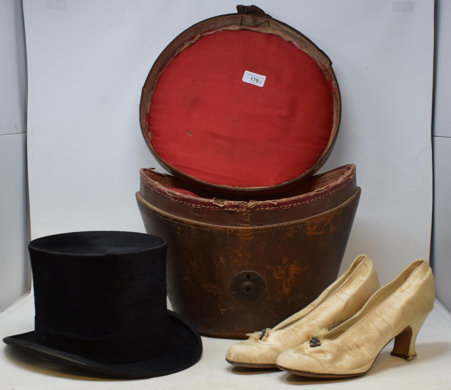 A 19th century moleskin top hat by Tress & co London, in period leather traveling case, and a pair