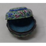 A Canton enamel pot and cover, decorated with flowers on a green ground, 3 cm diameter see images