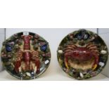 A pair of early 20th century Pallisy plates, one decorated with a lobster, the other with a crab,