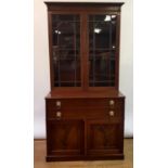 A 19th century mahogany secretaire bookcase having two glazed door above fitted drawer and